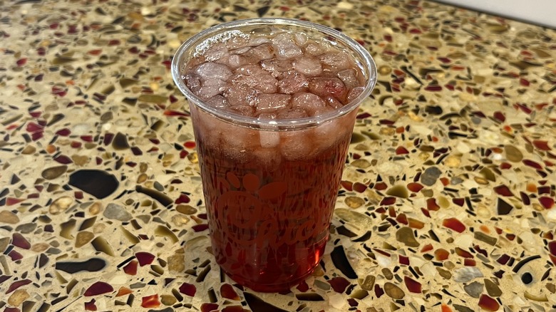 Pineapple Dragonfruit Iced Tea sits on a counter.