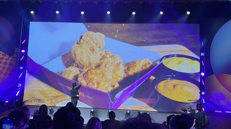 nuggets on screen in front of audience