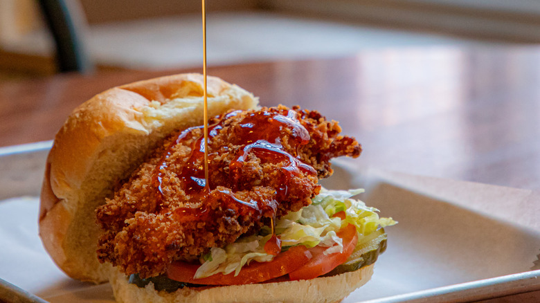 Honey sauce drizzled over fried chicken sandwich