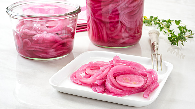 Pickled red onions on plate and on dish