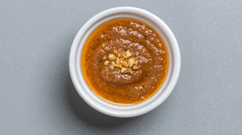 Thai peanut sauce in small circular dish