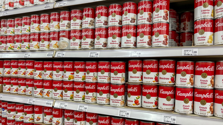 Supermarket shelves lined with Campbell's soup cans