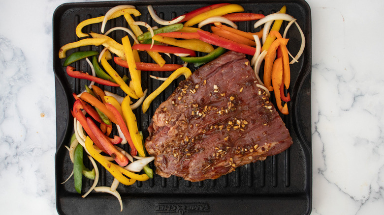 steak and vegetables on pan