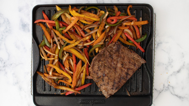 steak and vegetables on pan