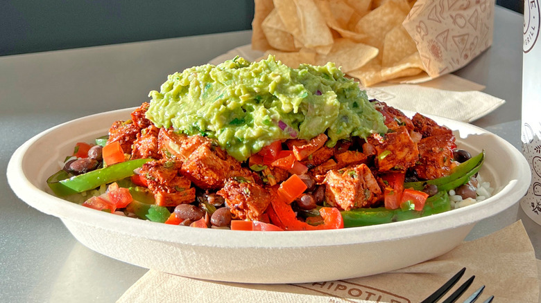 Chipotle bowl with guac and chips