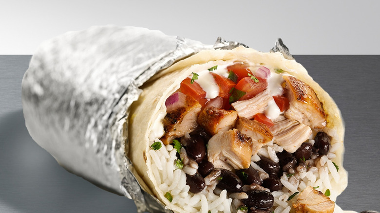 Chipotle chicken burrito in aluminum foil