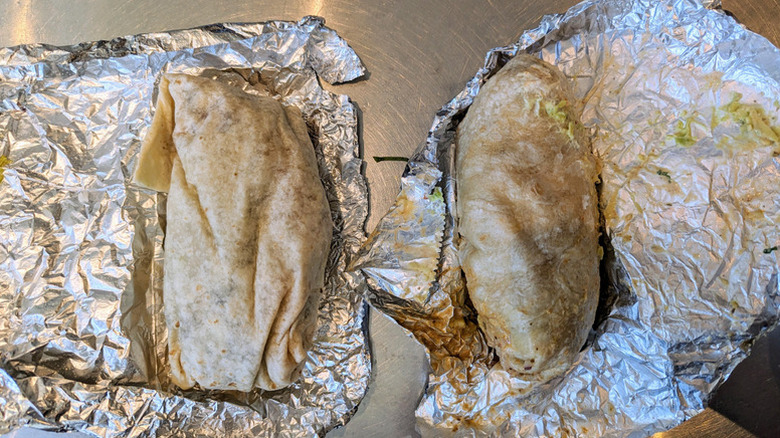 two burritos on foil