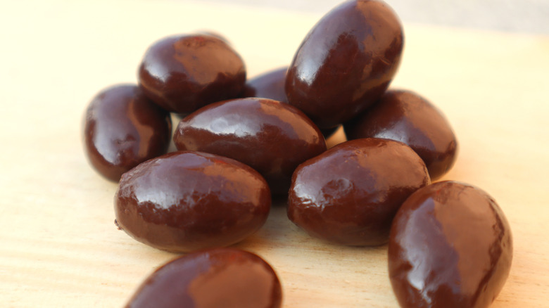 Stack of dark chocolate almonds