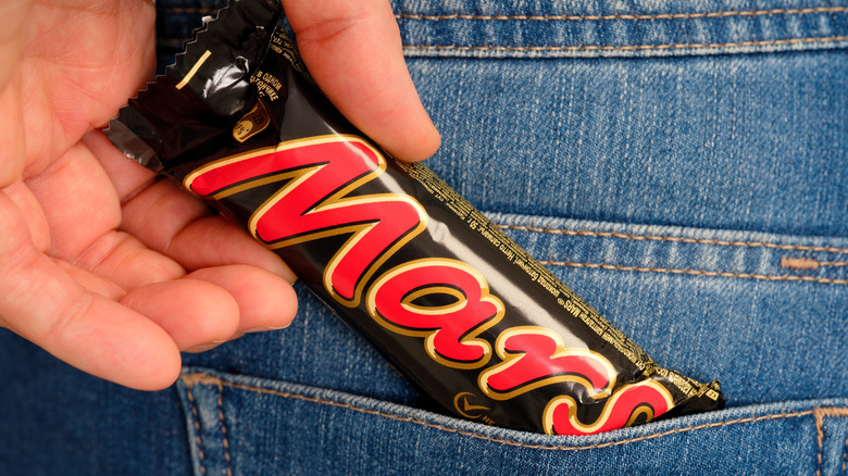 Mars Bar being taken from pocket