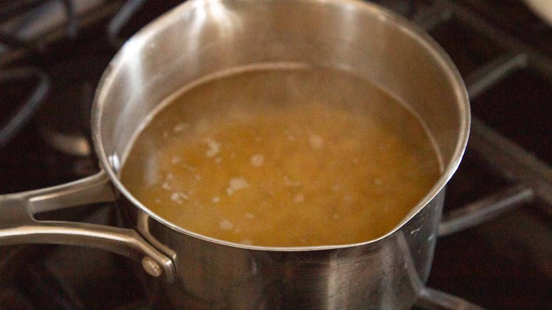 Pasta and water in saucepan