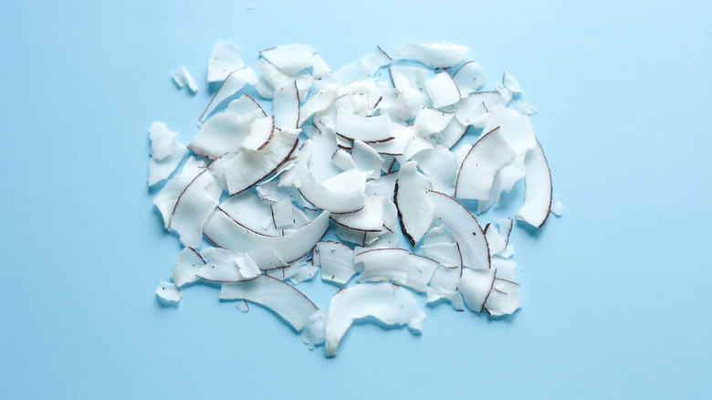 overhead angle of small pile of sliced coconut flakes