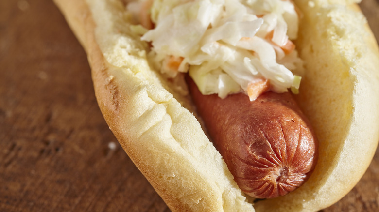 close up of a hot dog with coleslaw