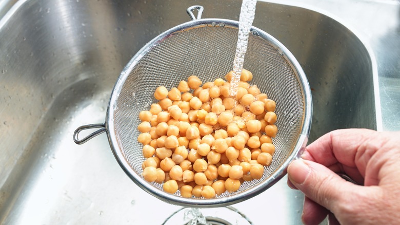 Rinsing chickpeas in sink