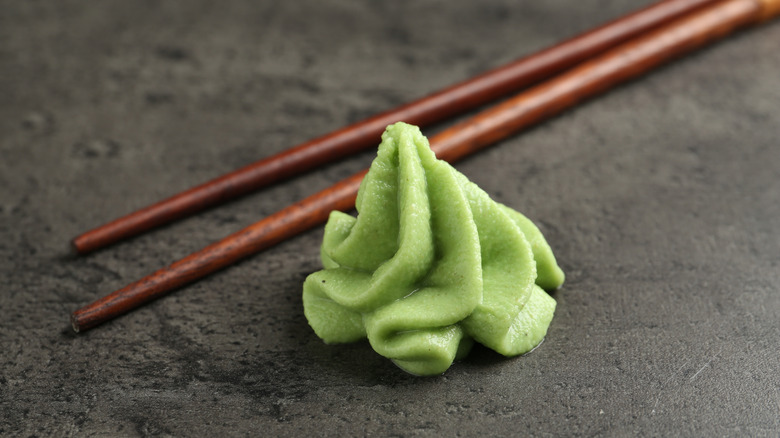 Dollop of wasabi next to chopsticks