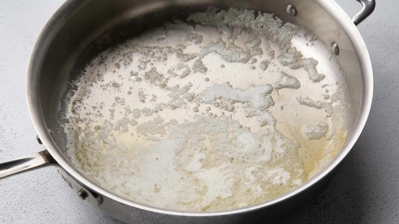 melted butter in a metal frying pan