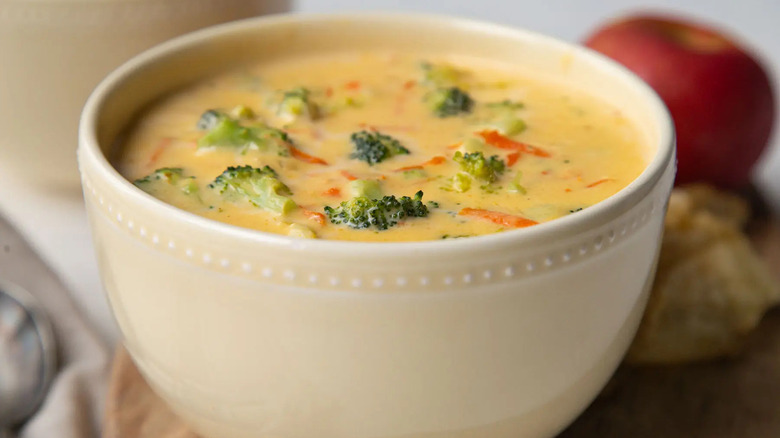 broccoli cheese soup in a white bowl