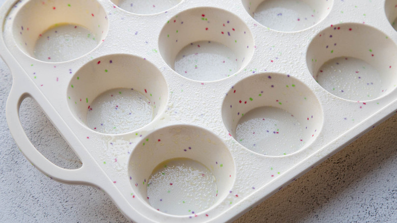 silicone muffin tin greased with cooking spray