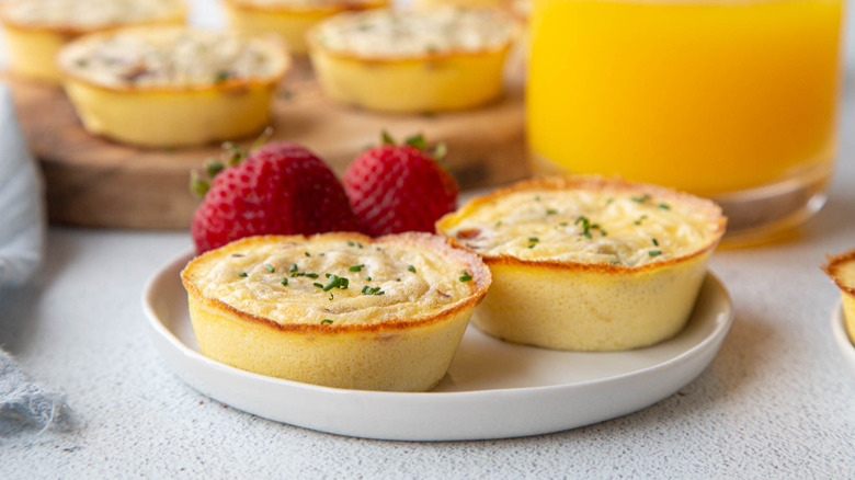 egg bites with bacon and gruyere with fresh strawberries