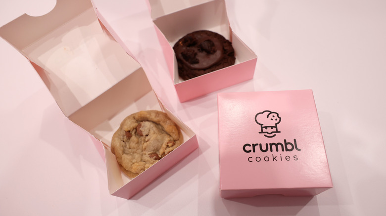 Crumbl cookies in pink boxes