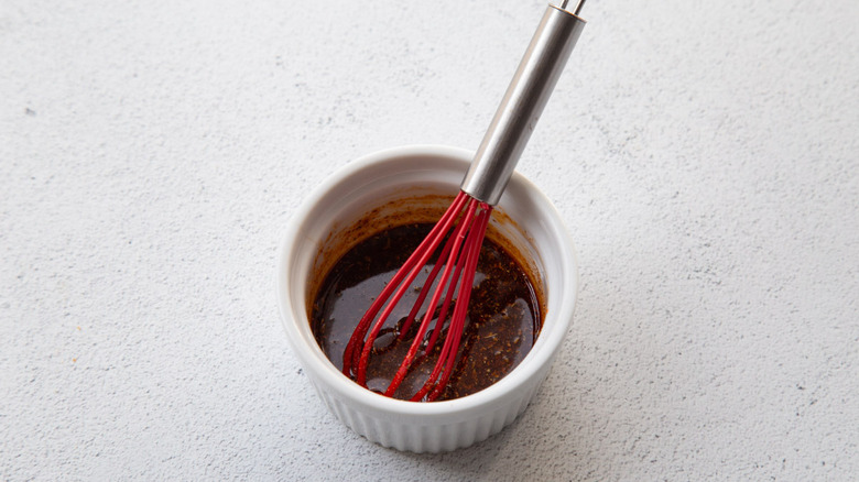 whisking spices with oil in ramekin