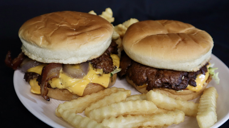 Two Culver's burgers on plate with Culver's fries