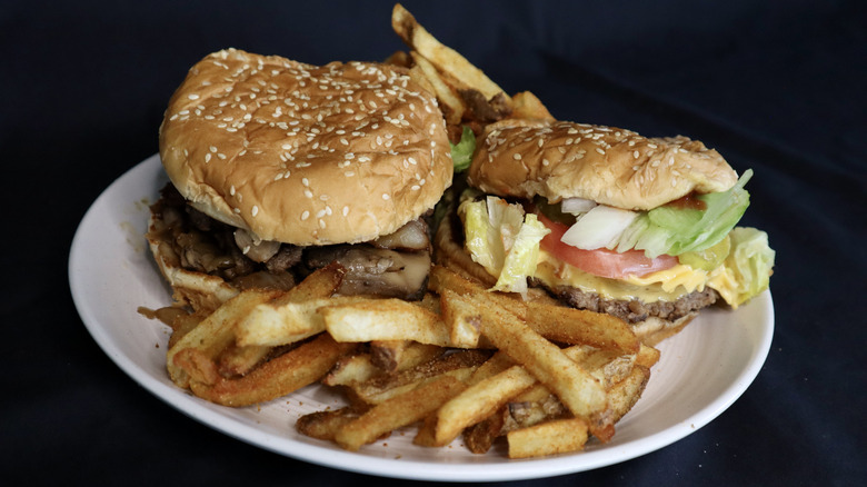 Two Five Guys burgers on plate with Five Guys fries