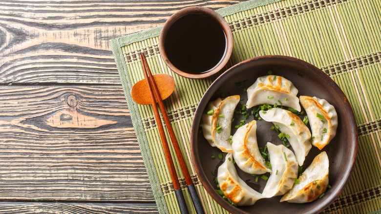 asian dumplings with a side of soy sauce