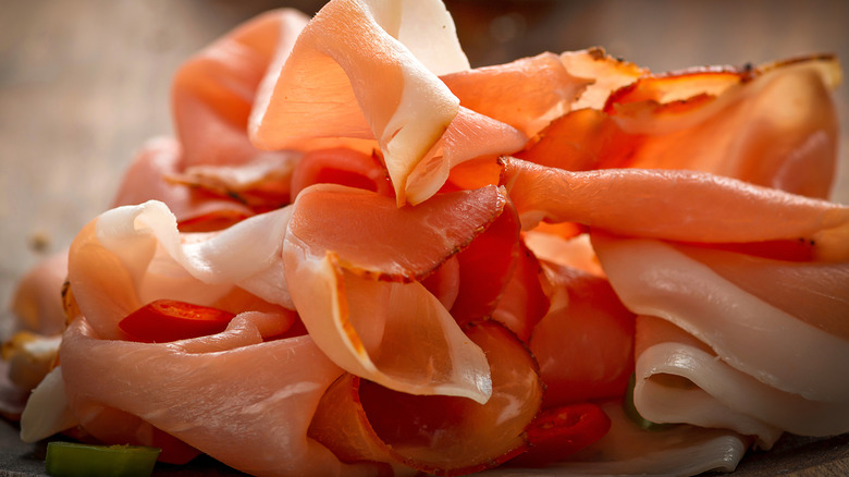 Pile of sliced processed deli ham