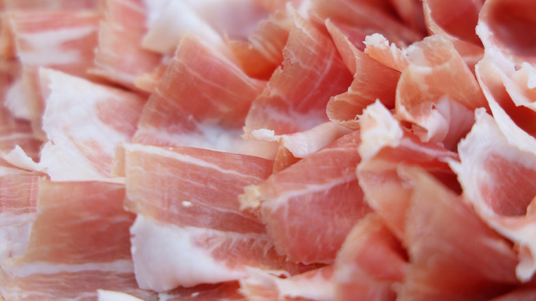 Large pile of prosciutto