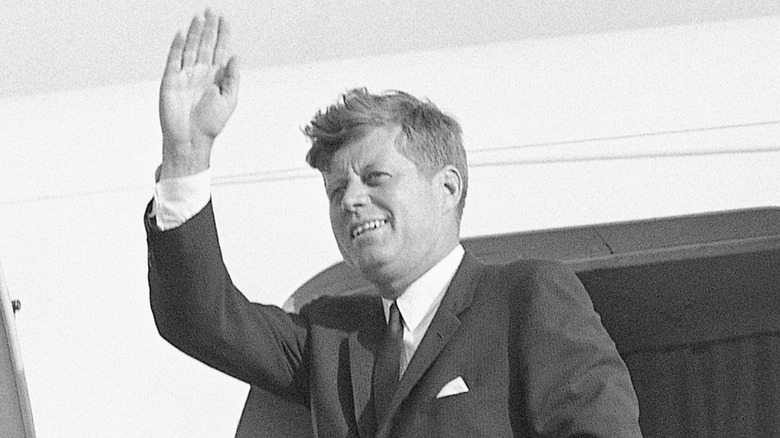 John F. Kennedy waves goodbye to West Berlin as he boards Air Force One in 1963