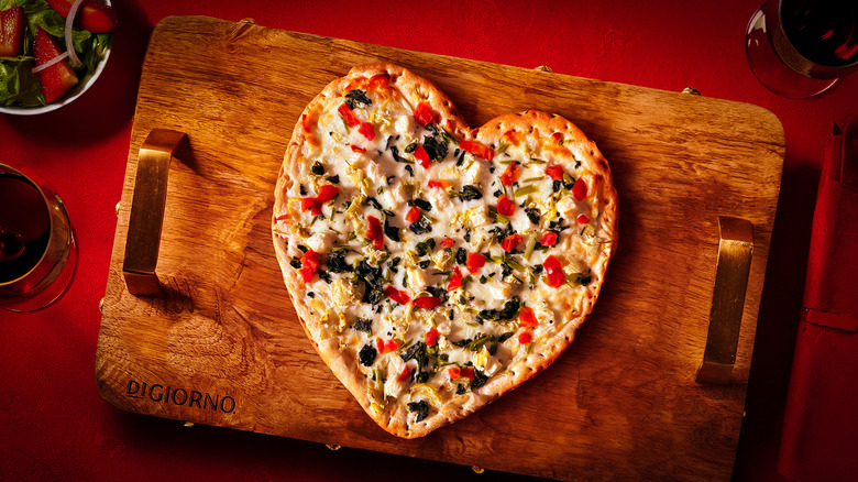 DiGiorno Heartichoke pizza on cutting board