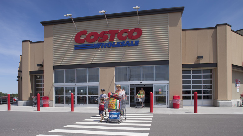 Shoppers leaving a Costco location