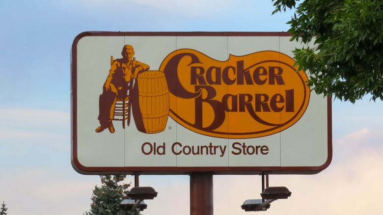 Cracker Barrel exterior standalone sign with a tree