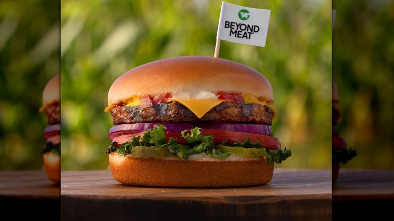 Beyond Meat Thickburger from Hardee's on a bench