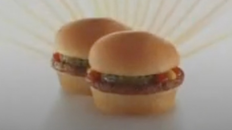 Two mini burgers against a white background