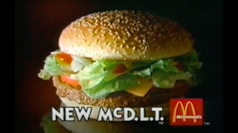 Burger with lettuce, cheese, and tomato in McDonald's ad