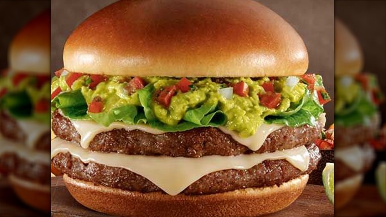 Burger with two beef patties, melted cheese, and guacamole