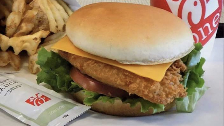 Chick-fil-A fish sandwich with fries and tartar sauce packet