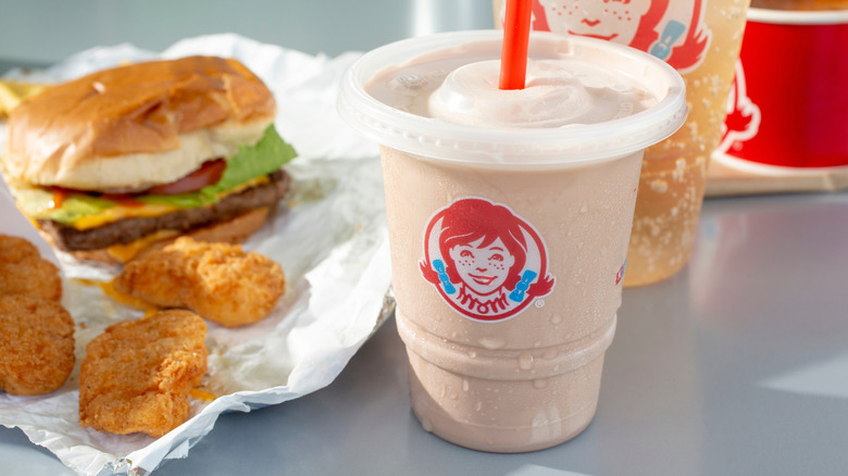 Chocolate Frosty with burger and nuggets