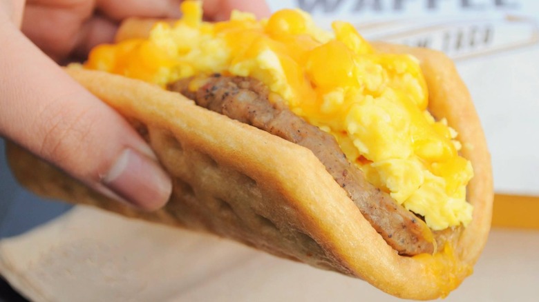 Hand holding a Waffle Taco