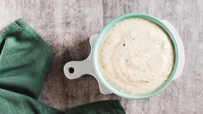 Bowl of ranch dressing with a green napkin