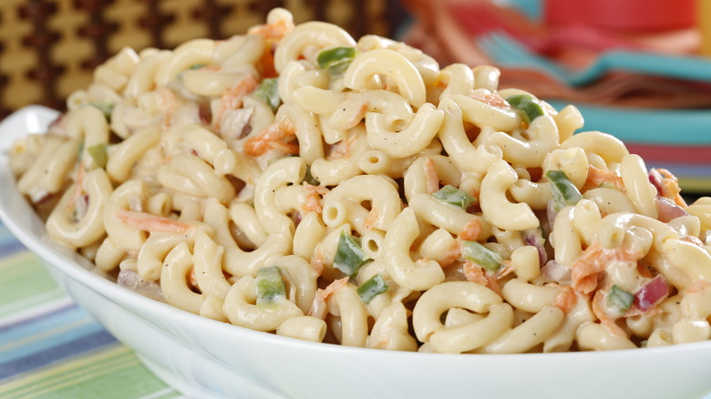 Macaroni salad in a white serving dish