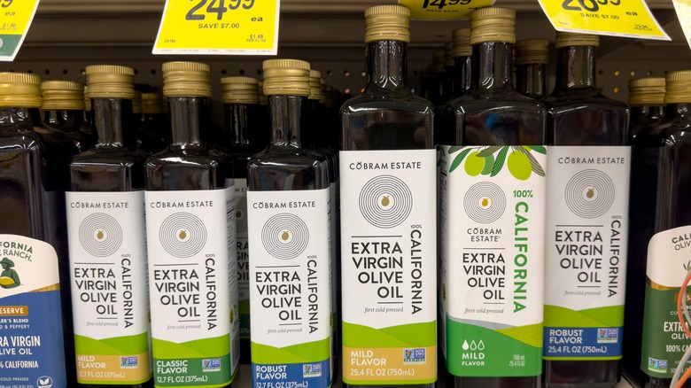 Bottles of California olive oil on a grocery store shelf