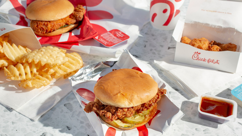 Chick-fil-A chicken sandwiches, waffle fries, and nuggets in wrappers