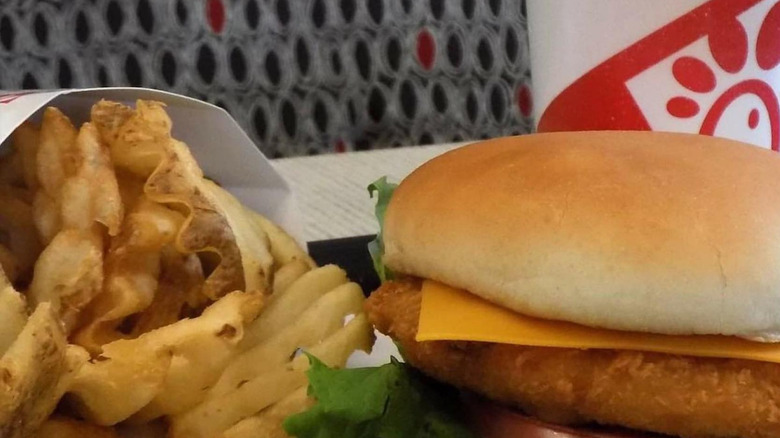 A Chick-fil-A fish sandwich with waffle fries