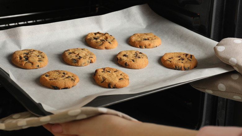 Taking cookies out of oven