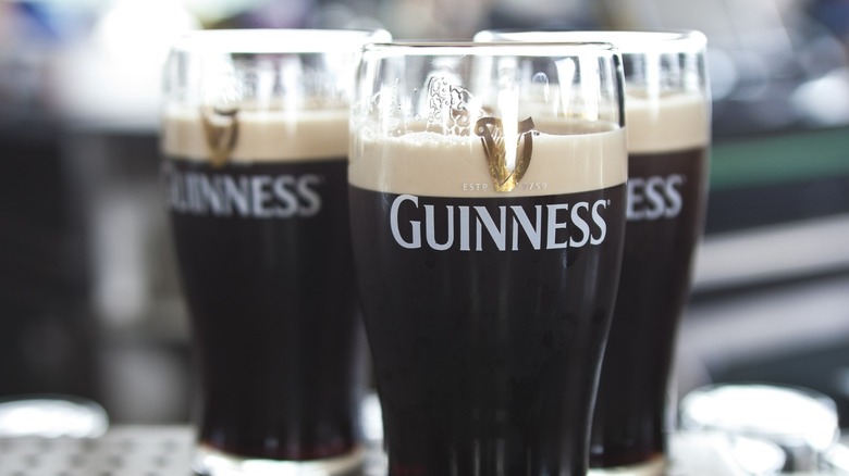 Three glasses of Guinness.