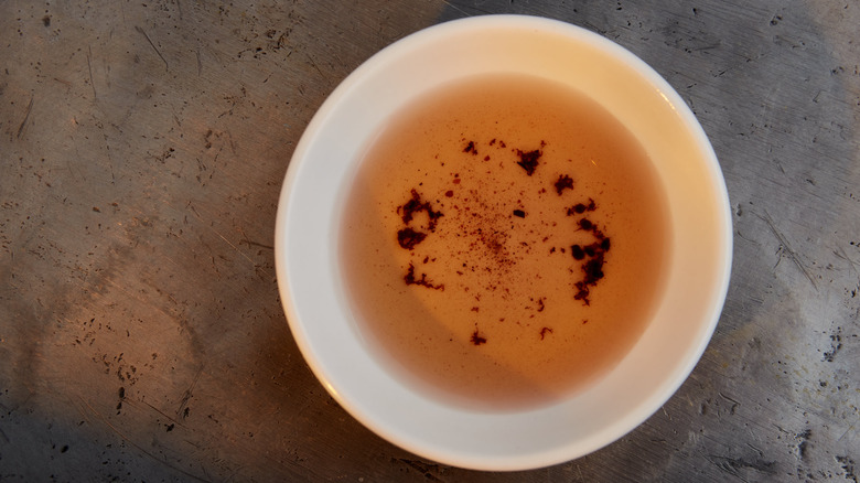 a bowl of red wine vinegar with sediment