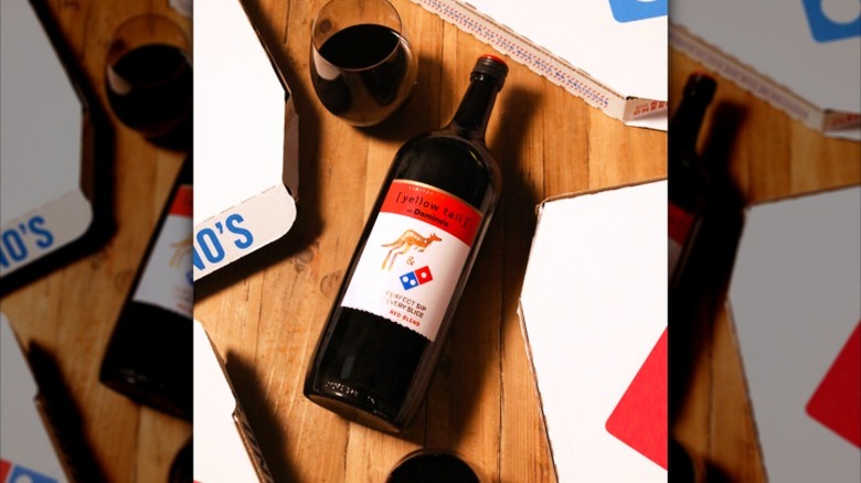 A bottle of Yellow Tail Domino's Red Blend is shown