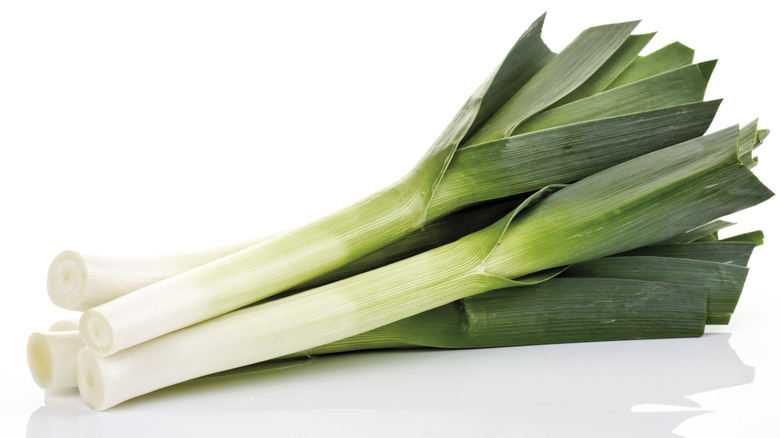 Whole leeks on a white background